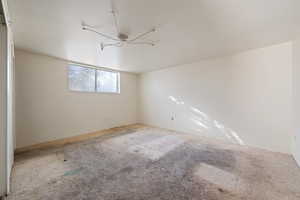 Unfurnished room featuring carpet