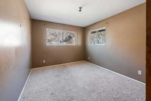 View of carpeted spare room