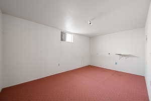 Basement featuring carpet flooring