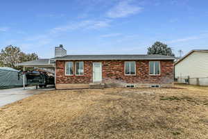 Single story home with a front yard