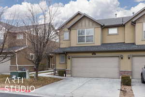 View of property with a garage