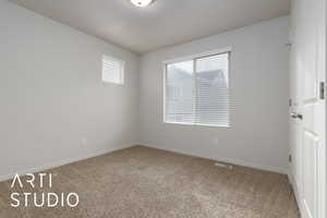 View of carpeted spare room