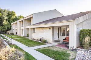 View of front of property with a front lawn