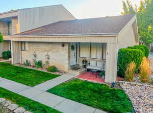 View of front of home featuring a front lawn