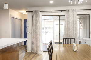 Dining space with light hardwood / wood-style floors