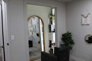 Corridor featuring hardwood / wood-style floors