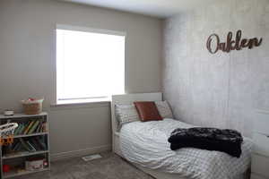 Bedroom featuring carpet