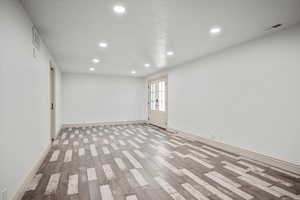 Spare room featuring light hardwood / wood-style floors