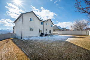 Back of house featuring a lawn