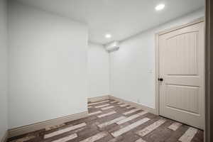 Unfurnished room with hardwood / wood-style floors