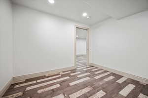 Empty room featuring wood-type flooring