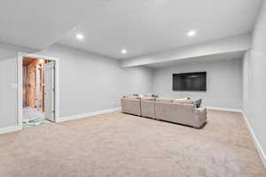 Basement Family Room with wet bar & bath rough plumbed in, & a huge storage room