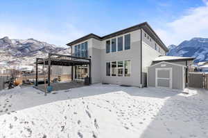 Backyard with hot tub, pergola, Tuff Shed, & built in gas firepit