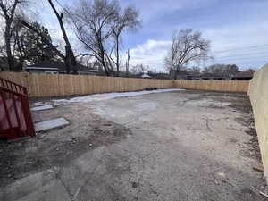 View of backyard with fence installed.