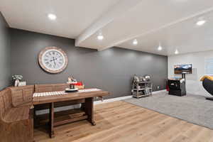 Basement Dining room featuring light wood-type flooring