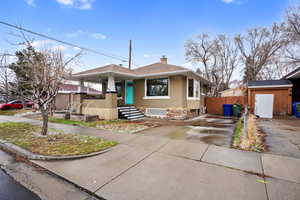 View of front of property featuring a shed