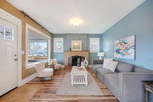 Living room featuring a fireplace and light hardwood / wood-style floors