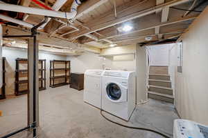 Laundry room with washer and clothes dryer