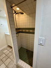 Bathroom featuring a tile shower