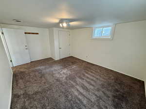 Unfurnished room featuring carpet