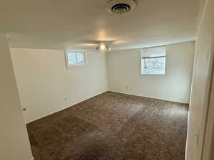 Empty room featuring carpet flooring