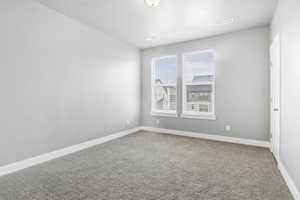 Empty room featuring carpet floors