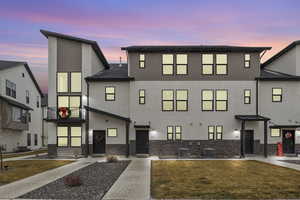 View of front of house with a lawn