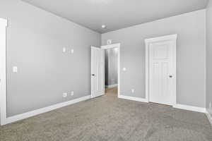 Unfurnished bedroom with carpet floors