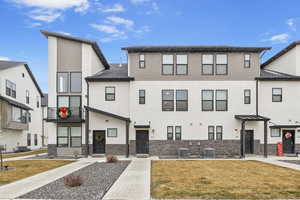 View of front of home with and a front lawn