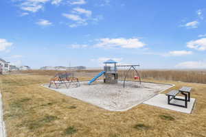 View of playground featuring a yard