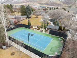 View of tennis court featuring a mountain view