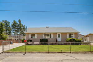 View of front facade with a front yard