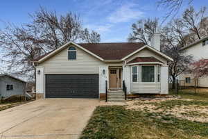 View of front facade featuring a garage