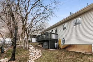 View of yard with a wooden deck