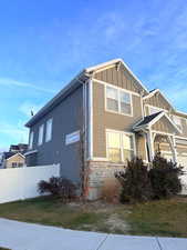 View of front of property with a garage and a front lawn