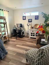 Living room with hardwood / wood-style flooring