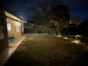 Yard at twilight with a patio