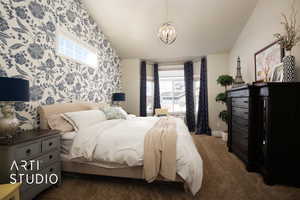 Bedroom featuring a notable chandelier, an accent wall, multiple windows, and wallpapered walls