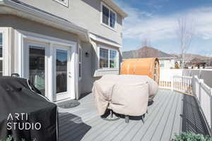 Deck featuring fence and grilling area