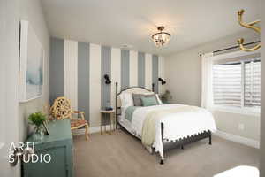 Bedroom featuring a notable chandelier, light carpet, visible vents, baseboards, and wallpapered walls