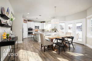 Dining room featuring recessed lighting, visible vents, baseboards, and wood finished floors