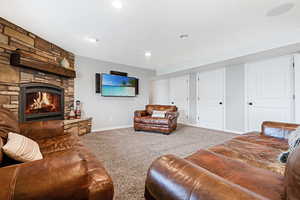 Living room with a fireplace and carpet