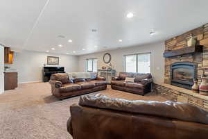 Carpeted living room featuring a fireplace