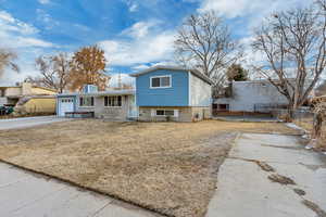 Split level home featuring a garage