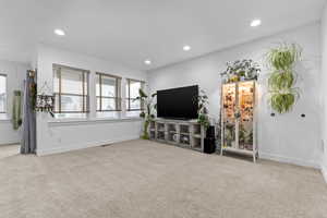 Living room with light colored carpet