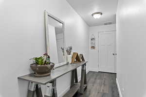 Interior space featuring dark wood-type flooring