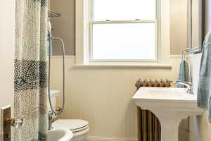 Bathroom featuring sink and toilet