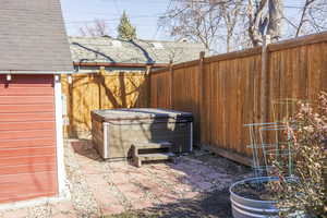 View of patio / terrace with a hot tub