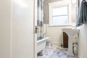 Bathroom featuring sink and toilet