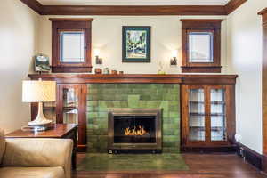 Interior details featuring ornamental molding and hardwood / wood-style floors